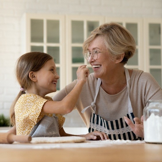 Older woman enjoying the benefits of dental implants