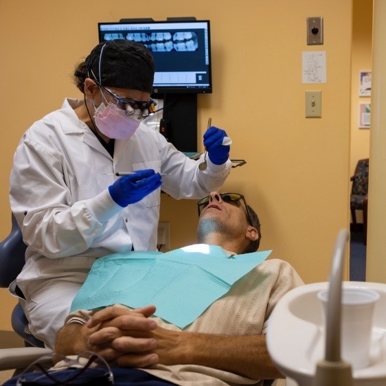 Patient receiving scaling and root planing gum disease treatment