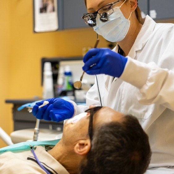 Dental patient receiving fluoride treatment