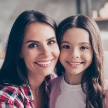 Mother and child smiling after children's dentistry visit