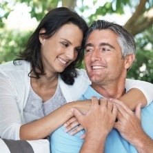 Man and woman with attractive smiles after cosmetic dentistry